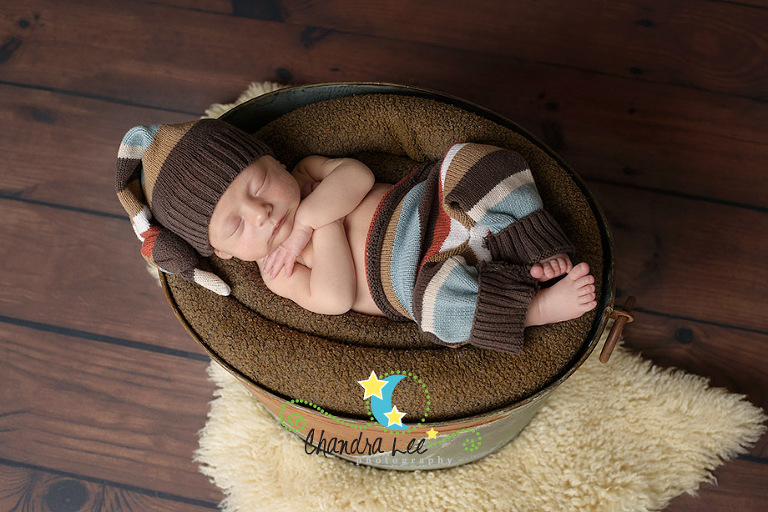 Image of Baby Sleeping in Galvonized Bucket