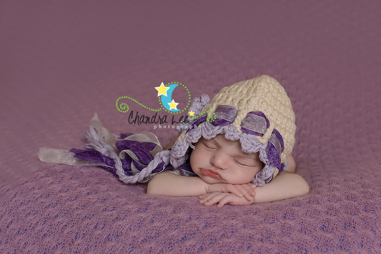 Image of Baby Wearing Purple Lace Bonnett