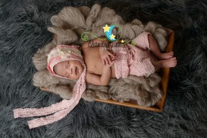 Photo of Sleeping Newborn in Basket